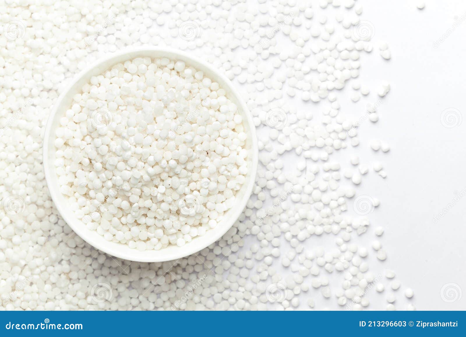 close-up of organic white  sago or sabudana big size in white ceramic bowl with the gradient background of sago.