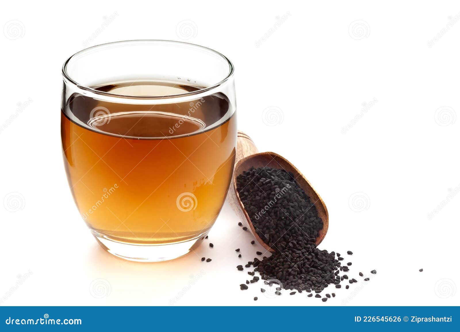 close-up of original  organic boiled water tea or kada  of  kalonji nigella sativa  in a transparent glass cup over white