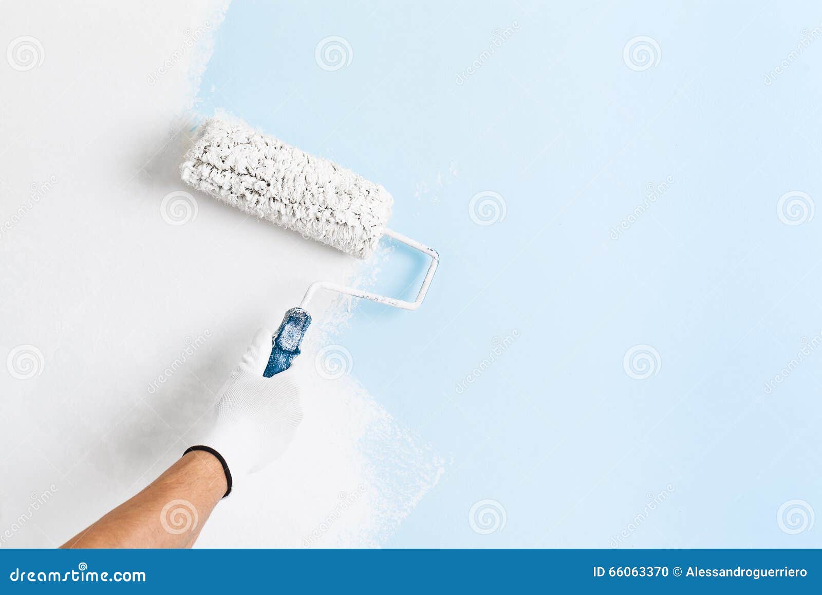 close up of painter hand painting a wall