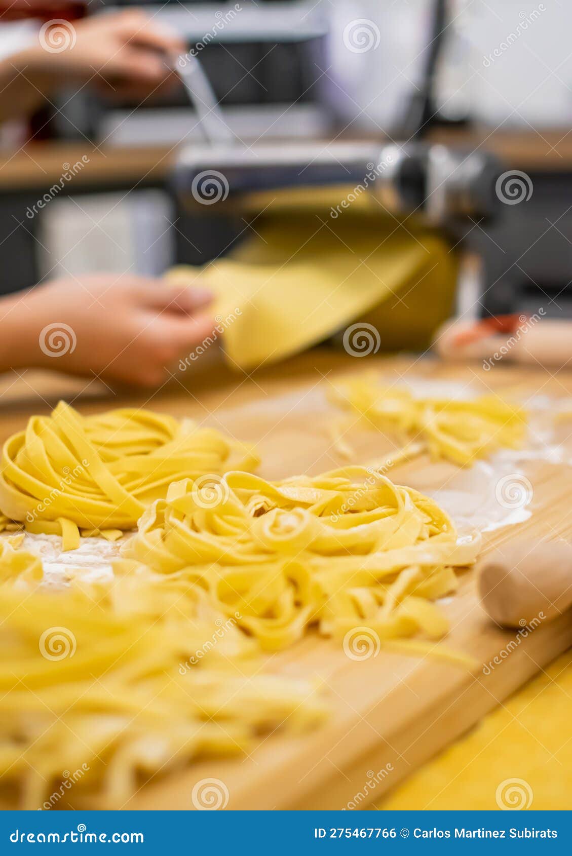 Close Up of Pasta and Hands Making Home Made Italian Pasta Stock Photo