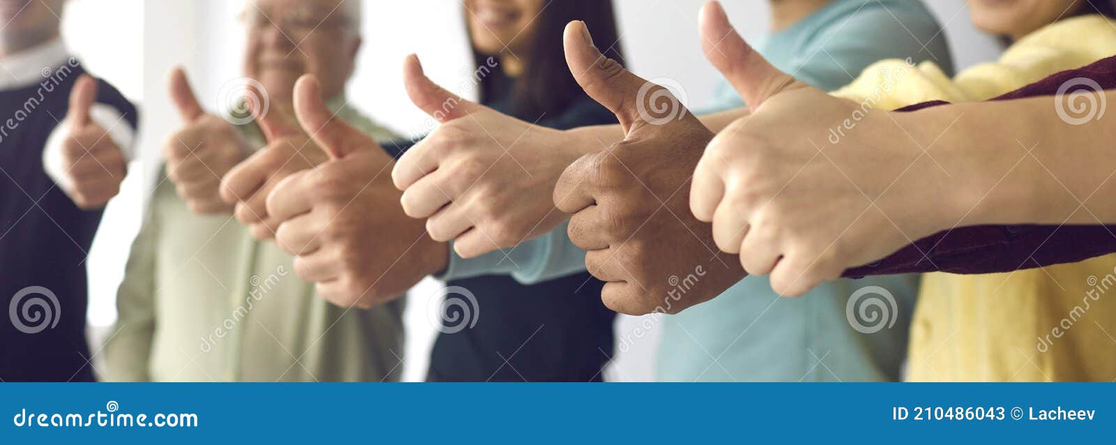 close up of people of all ages showing thumbs up as a  of recommendation and approval.