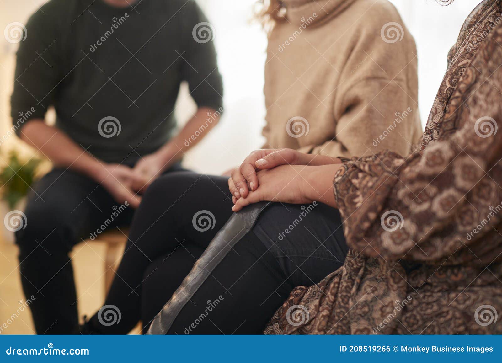 close up of people attending support group meeting for mental health or dependency issues