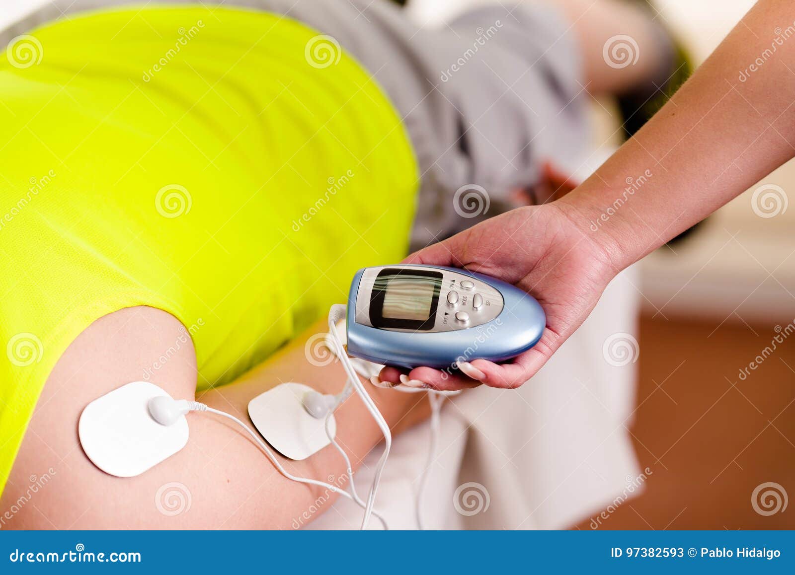 Closeup of a Personal Trainer Holding with One Hand the Electric