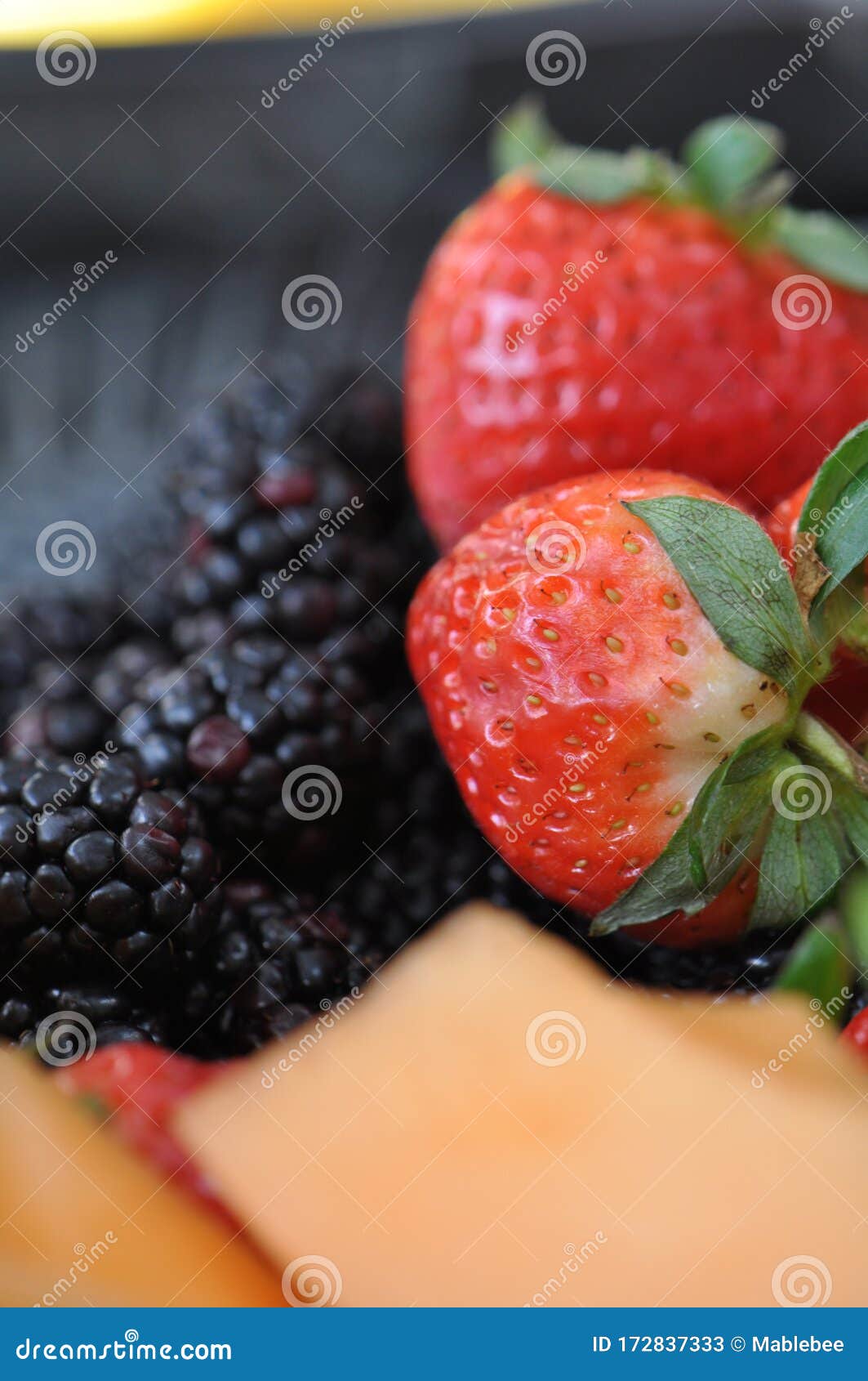 Close Up Photograph of Red Strawberries, Orange Melon and Blackberries ...