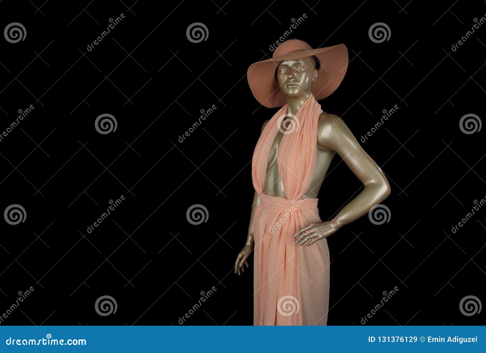 close-up pink colored lifeless mannequin on black background