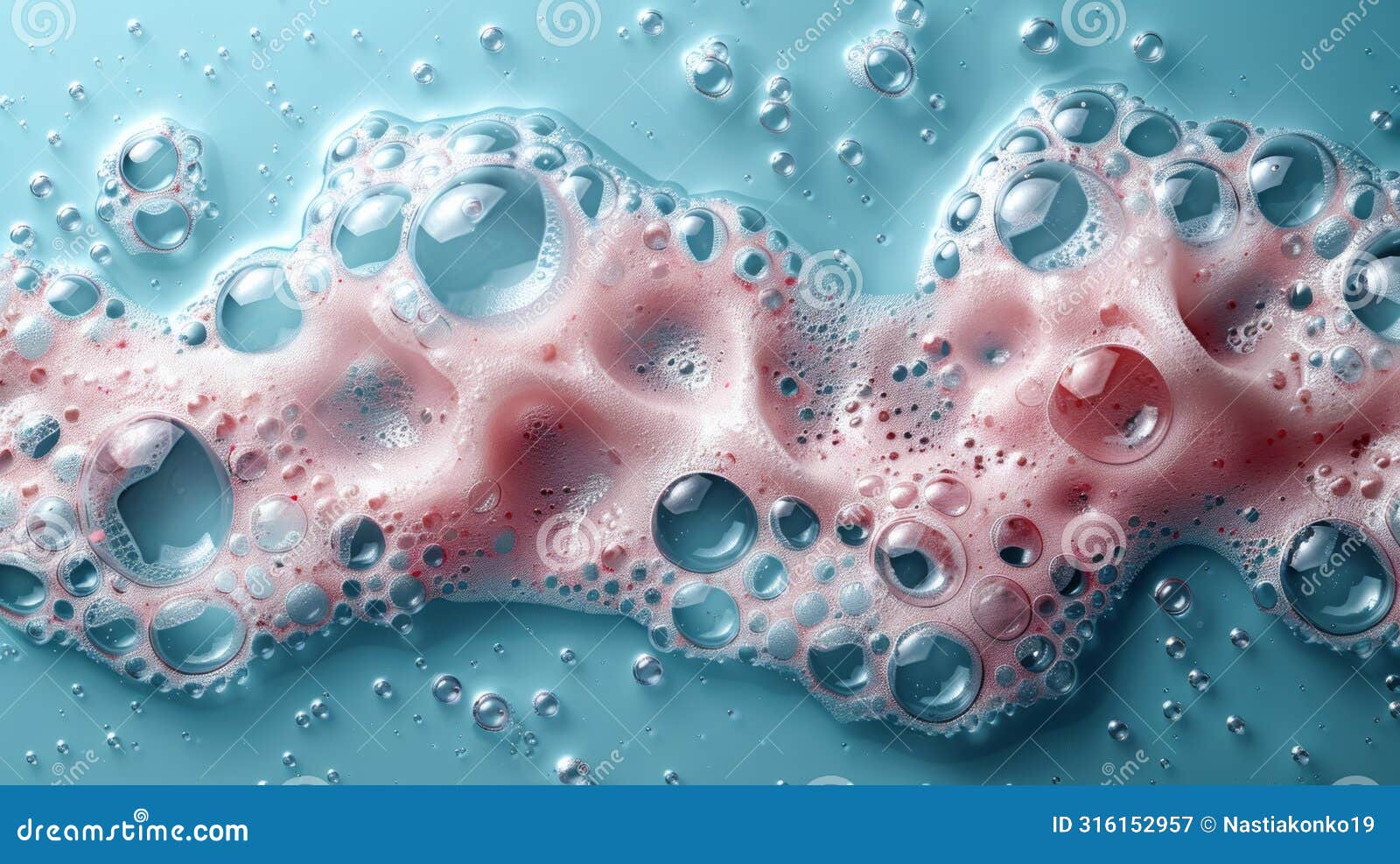 close up pink foam bubble on blue background. soap sud