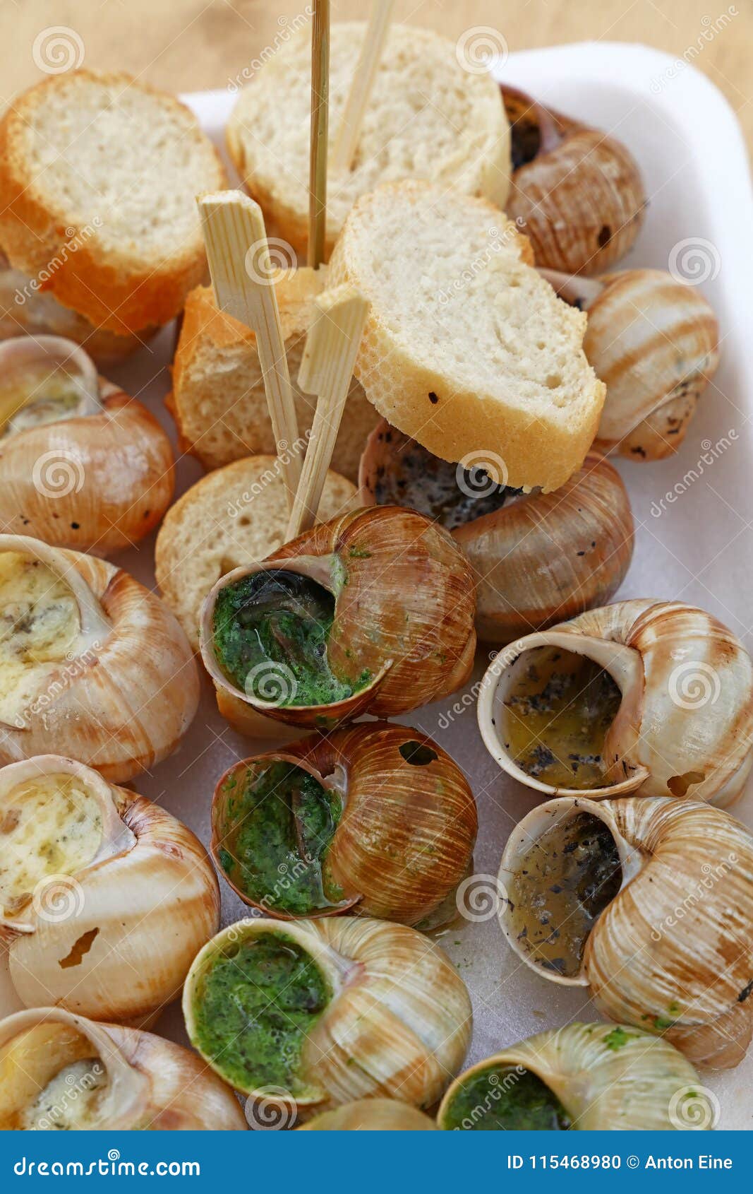 Close Up Portion of Cooked Escargot Snails Stock Photo - Image of herbs ...