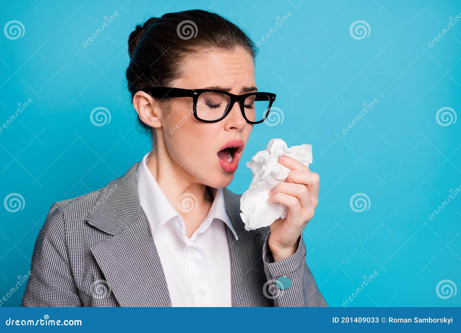 close-up portrait of attractive sick lady teacher sneezing having flu using napkin  over bright blue color