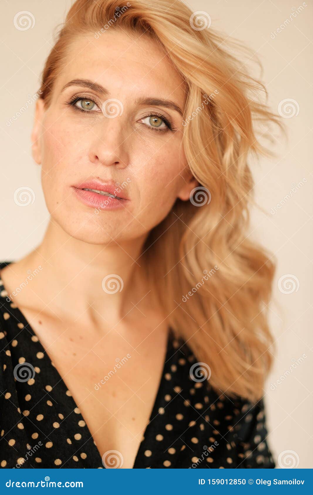 Close Up Portrait Of A Beautiful Adult Woman 35 45 Years Old With Blond Hair In A Black Dress
