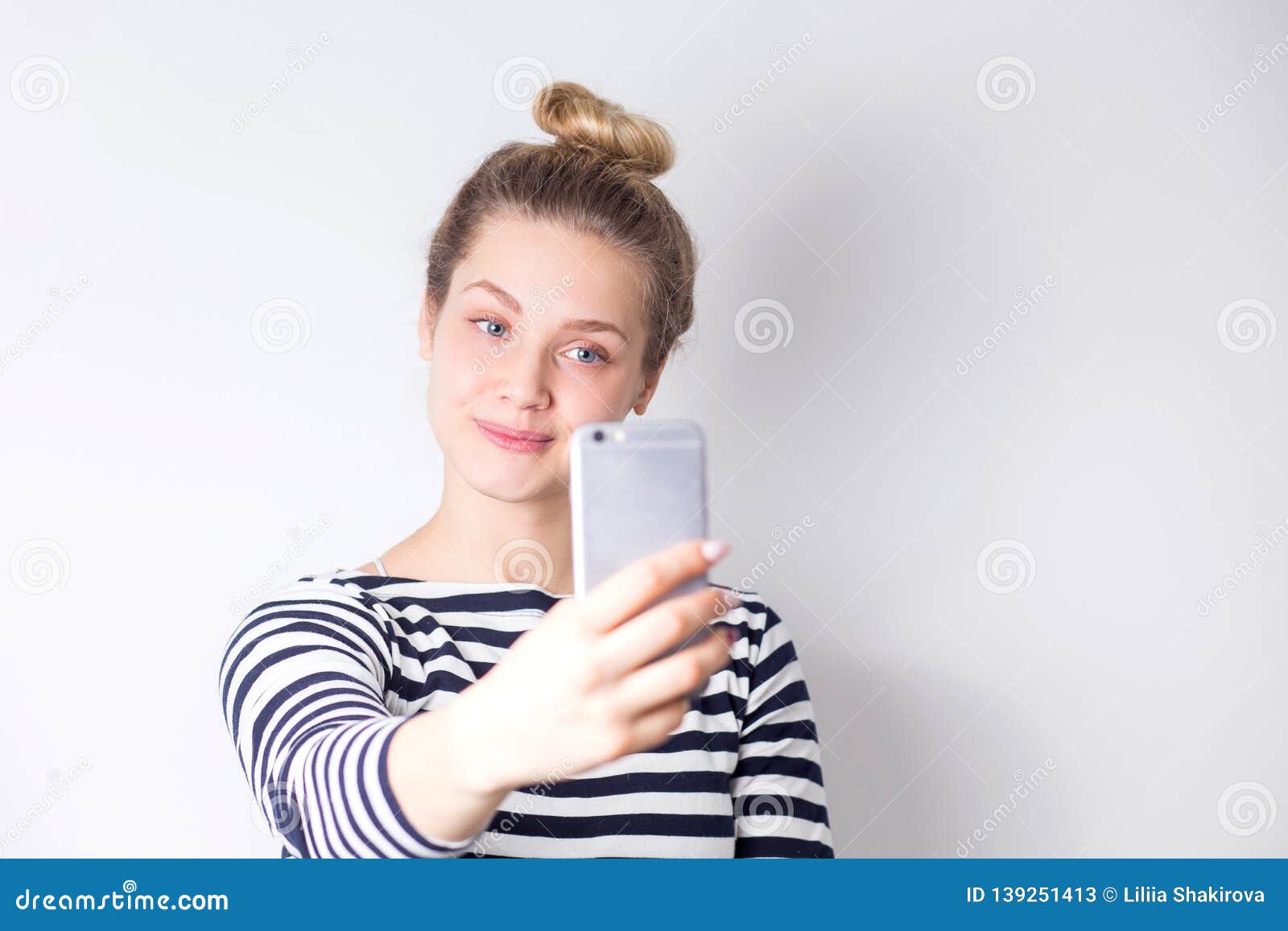 Close Up Portrait Of Beautiful Attractive Blonde Woman Taking Selfie On Smartphone On White