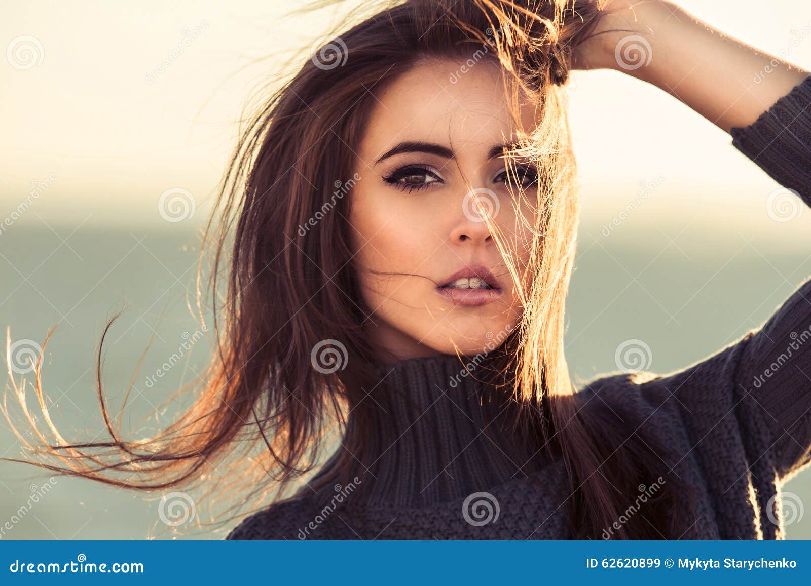 close-up portrait of beautiful brunette woman outdoors