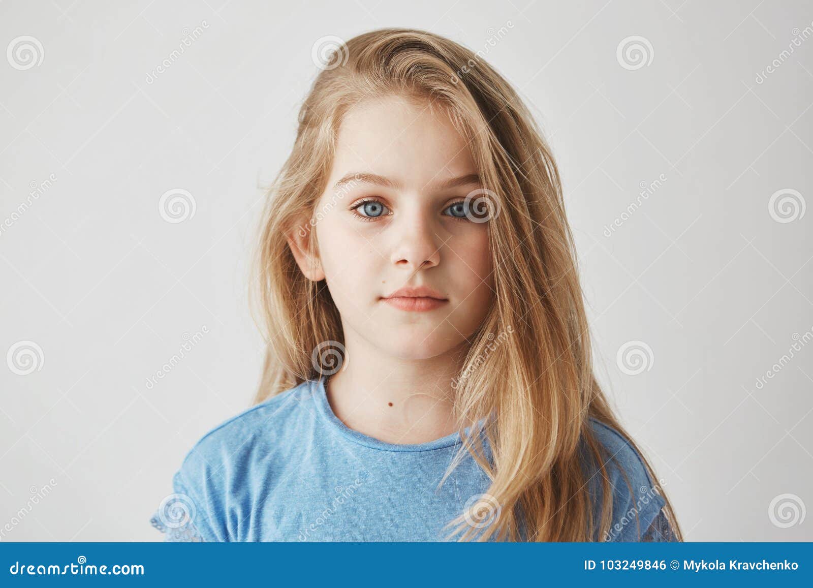 Close Up Portrait Of Beautiful Little Girl With Light Long Hair