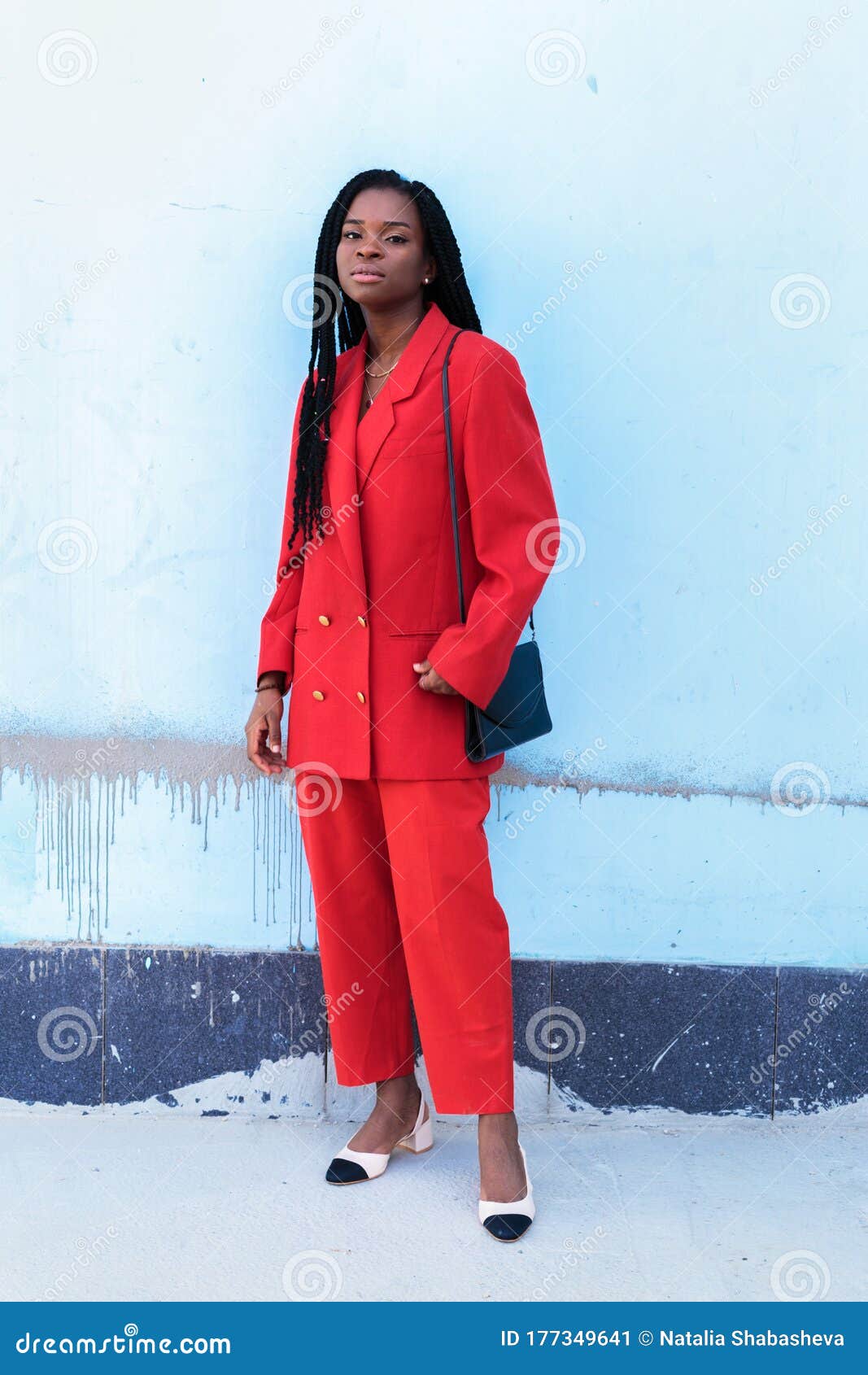 Close Up Portrait of a Beautiful Young African American Woman with Pigtails  in Red Business Suit Smiling Over Blue Background Stock Image - Image of  ethnic, business: 177349641