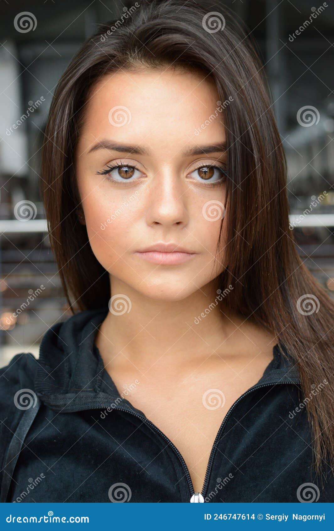 Close-up Portrait of a Beautiful Young Brunette Girl with Big Eyes