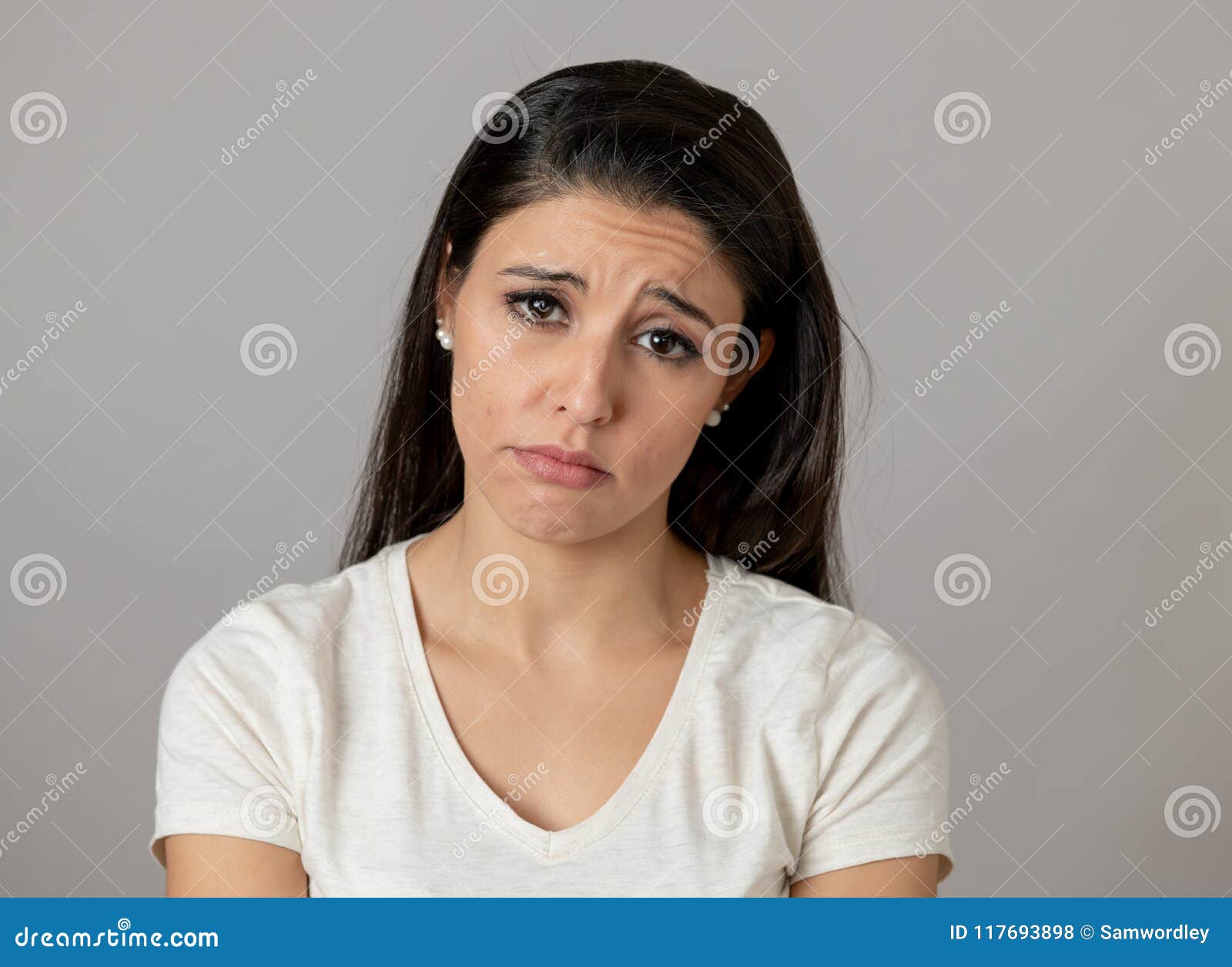 human expressions, emotions. young attractive woman with a sad face, looking depressed and unhappy
