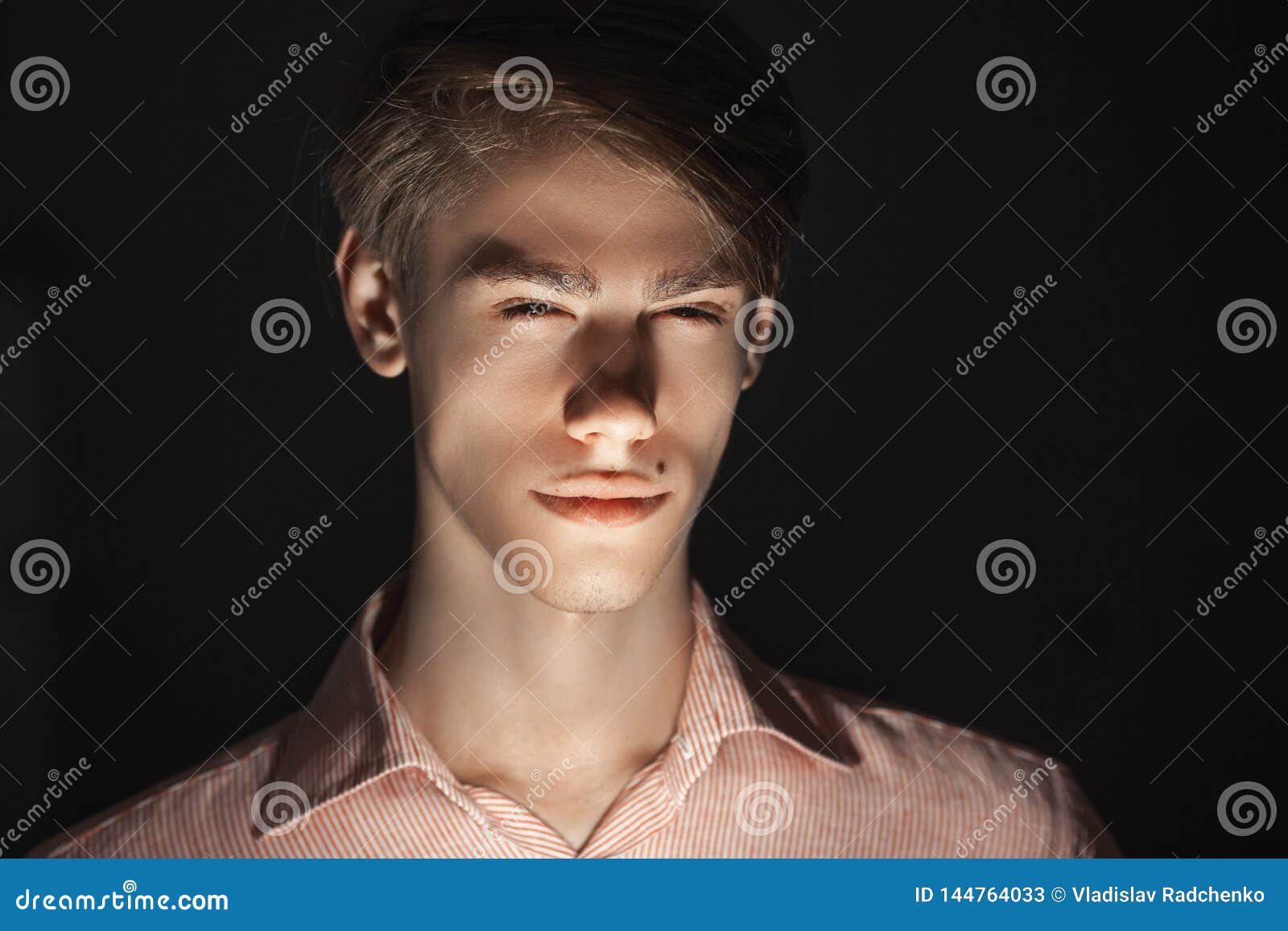Close-up of Caucasian Attractive Young Man Blinked His Eyes. Light Shines from Below Stock Image - Image of cheerful, exressing: 144764033