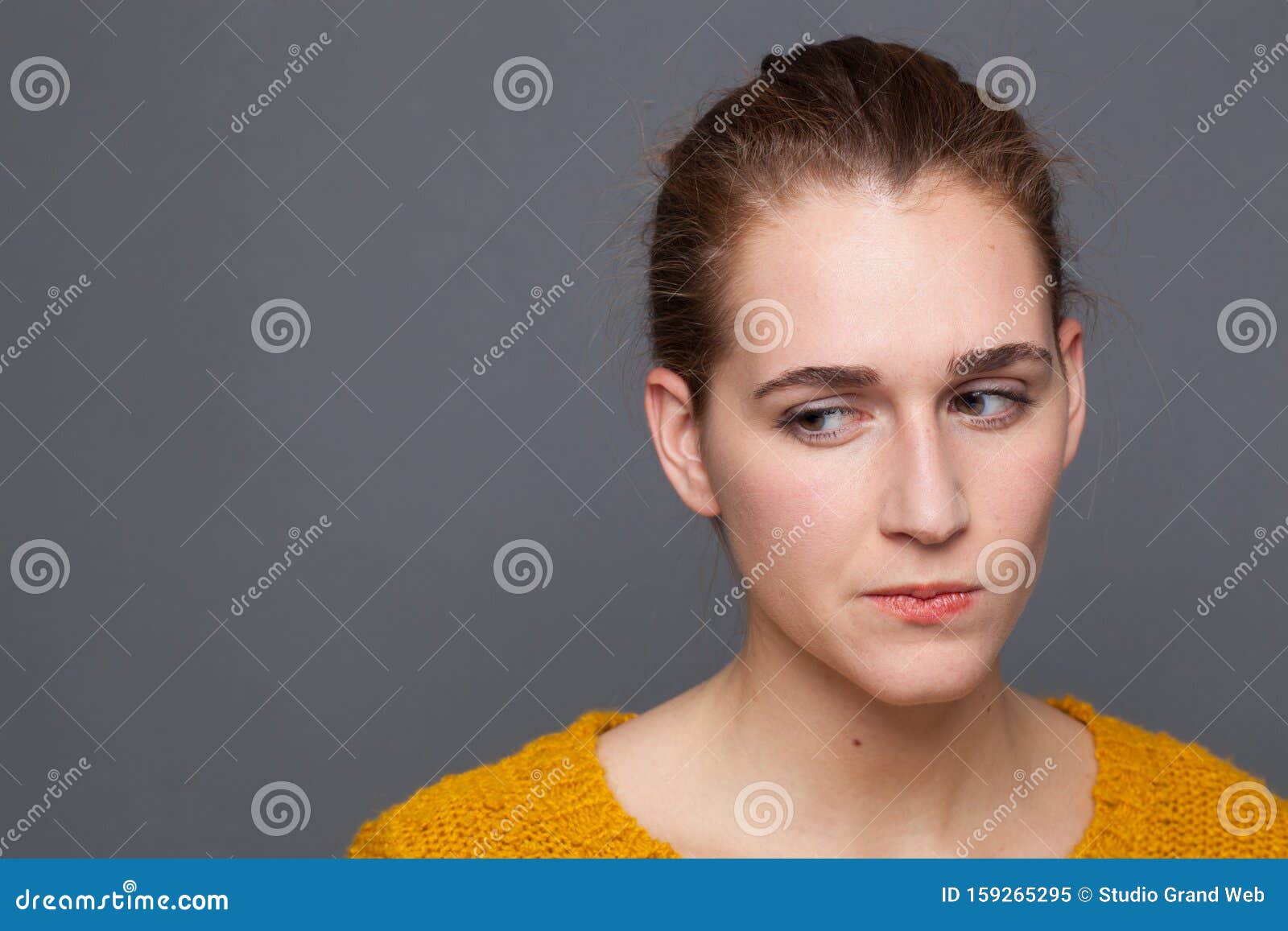 concerned young woman thinking, expressing doubt, insecurity, suspicion or distrust