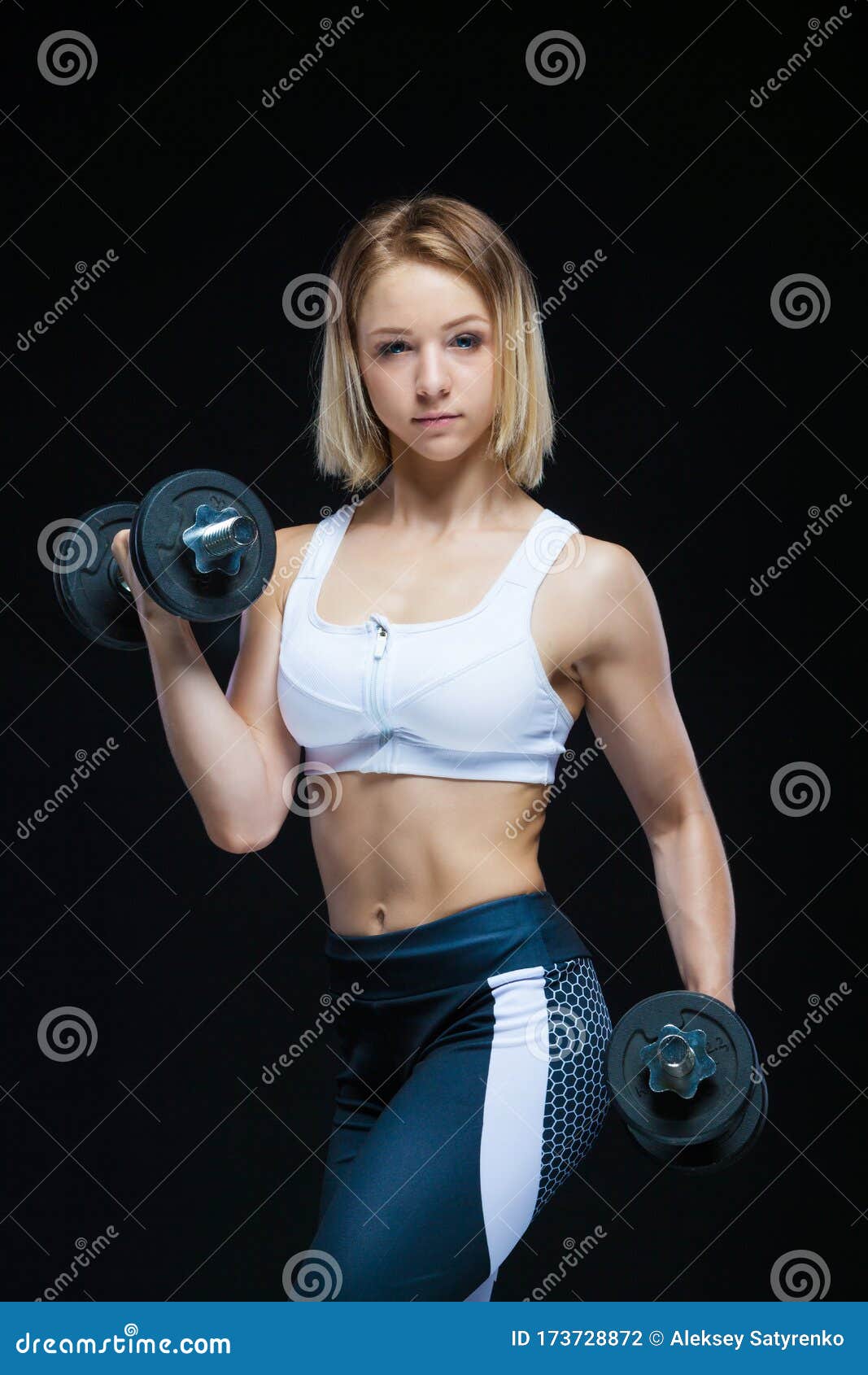 Close-up Portrait of a Fitness Muscular Young Girl Posing with Dumbbells at  the Gym Isolated on a Black Background Stock Photo - Image of exercise,  abdominal: 173728872