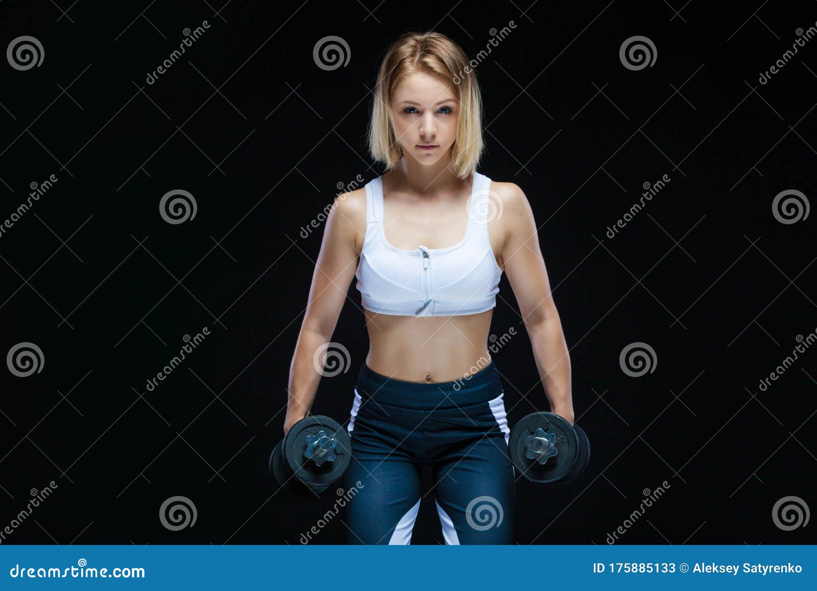 Closeup Portrait Of A Fitness Muscular Young Girl Posing With