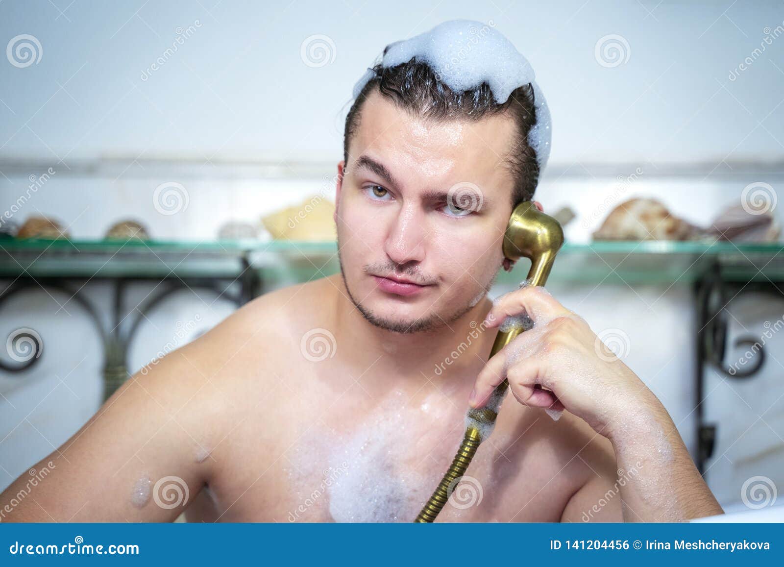 Close Up Portrait of Funny Man Having Fun Relaxing in Shower Taking
