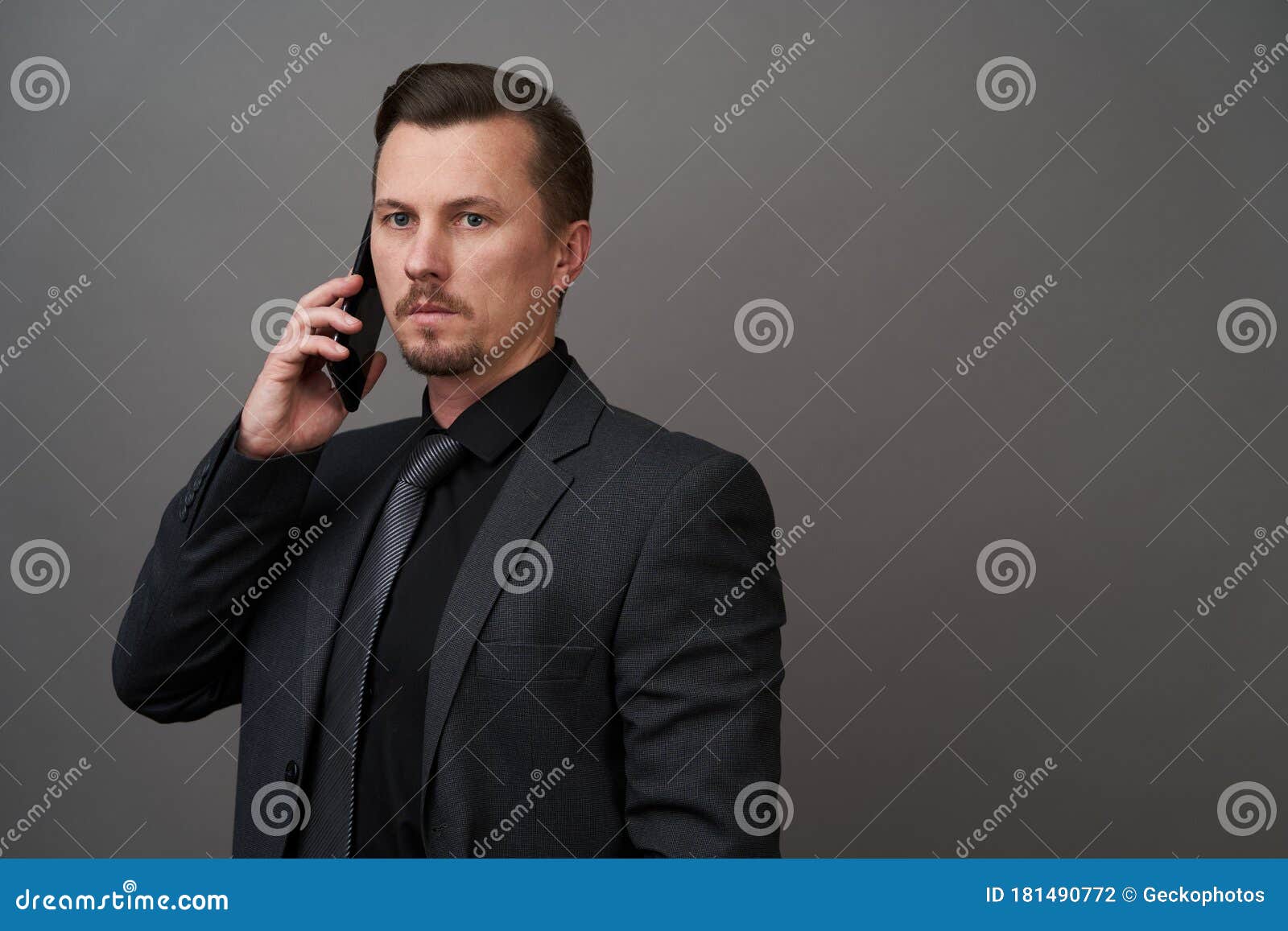 Closeup Portrait Of Handsome Young Businessman Using