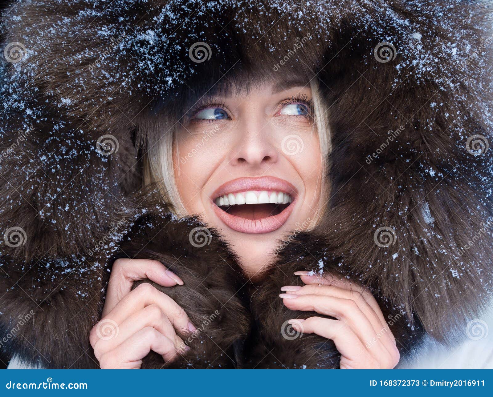Close Up Portrait of a Happy Woman in Fur Hood Looking by Side. Stock ...