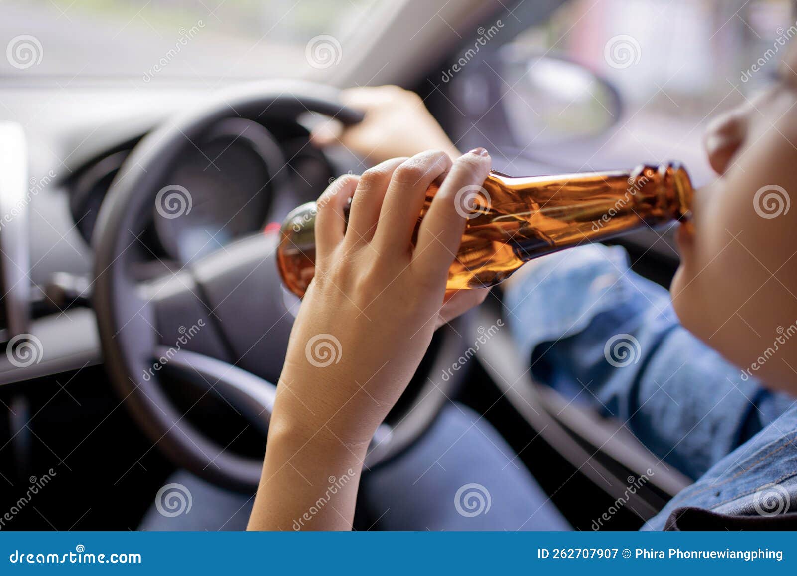 Close Up Portrait of Human Drinking Alcohol while Driving Stock Image