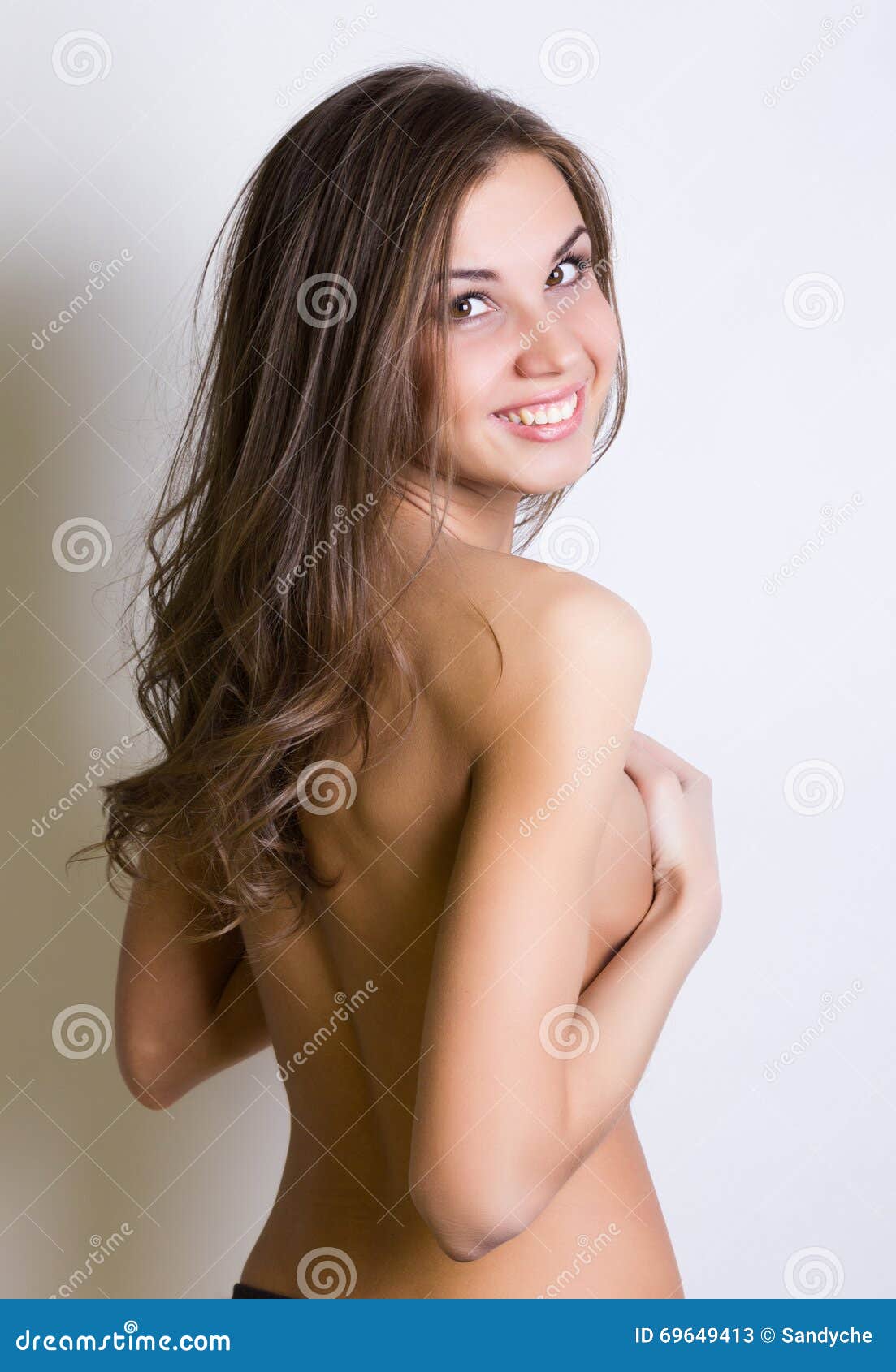 Woman Covering Her Big Breasts with Her Hands Stock Photo - Image