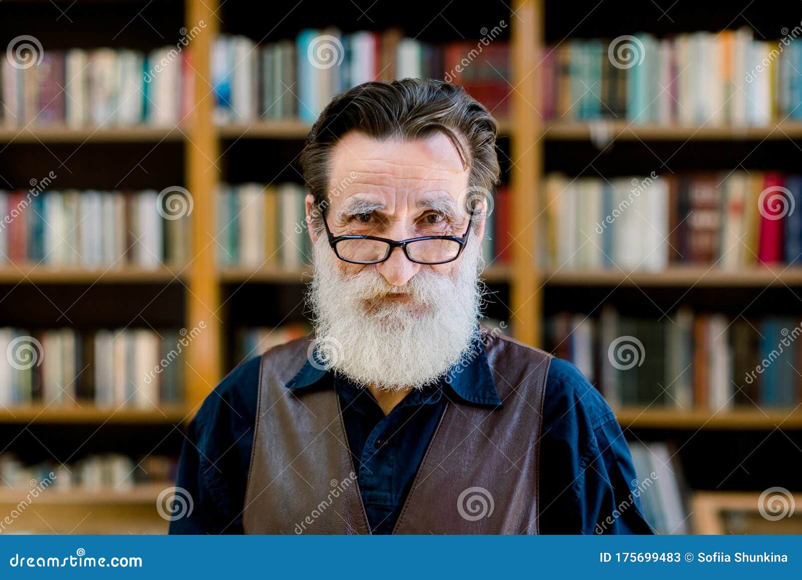 Close Up Portrait Of Senior Man With Beard And Eyeglasses