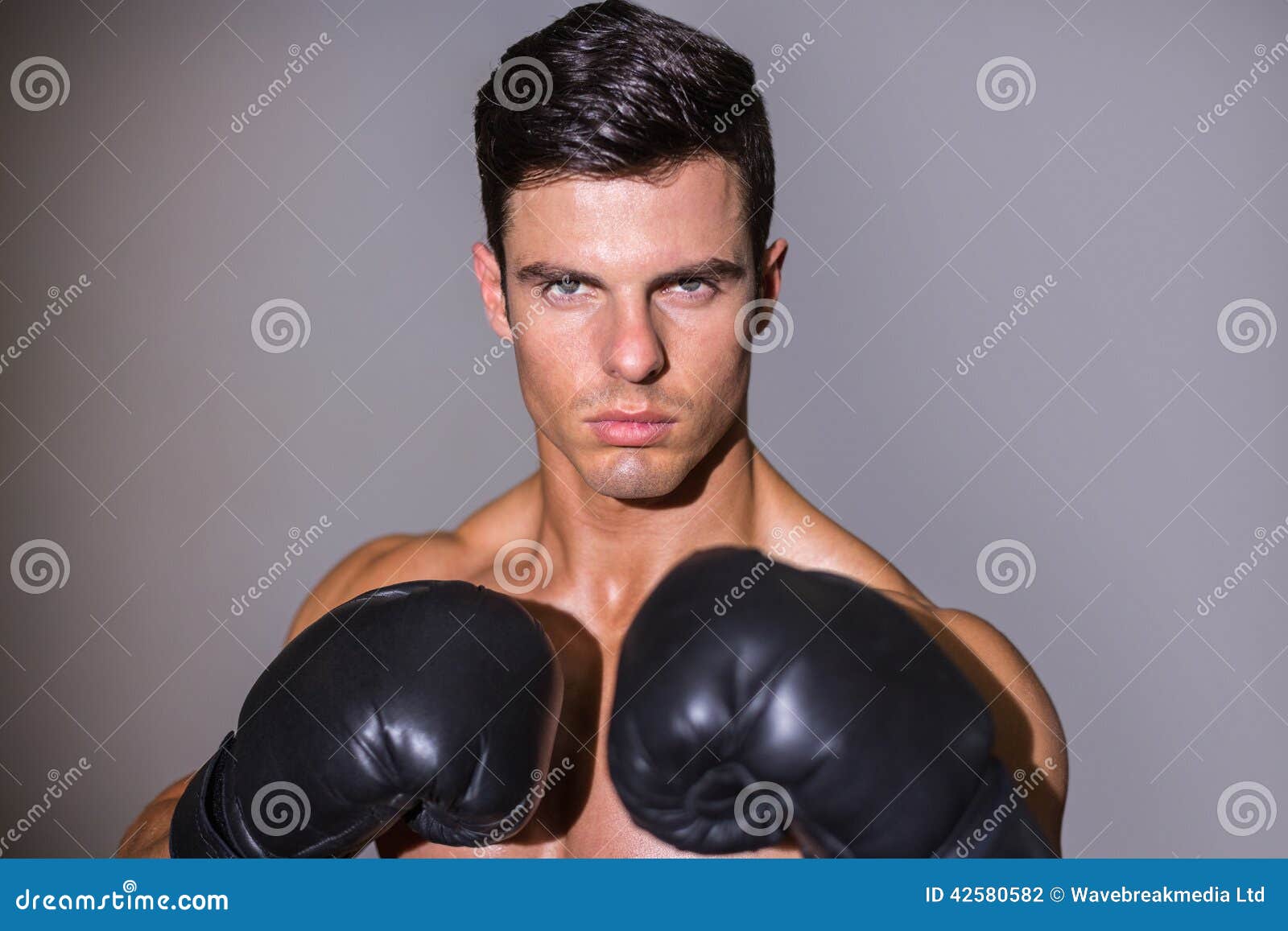 Smiling shirtless muscular man in gym — Stock Photo 