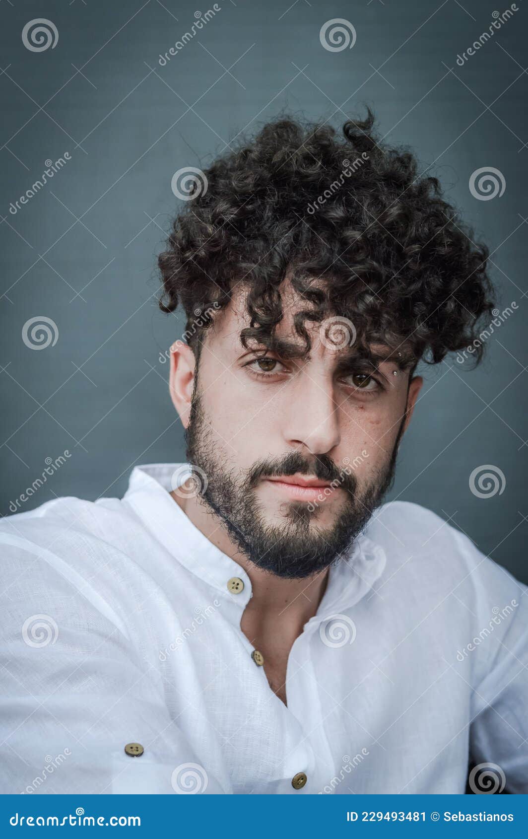 Close Up Portrait Of A Young Man With A Beard And Curly Hair, Looking At  The Camera Stock Image - Image Of Cheerful, Eyes: 229493481