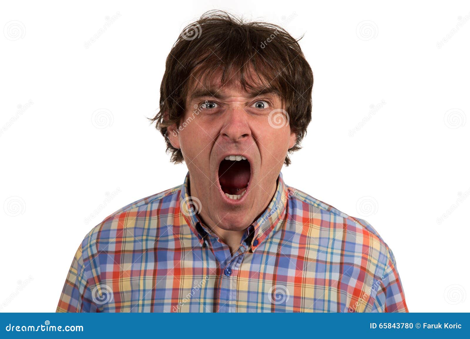 close up portrait of young man yelling with open mouth