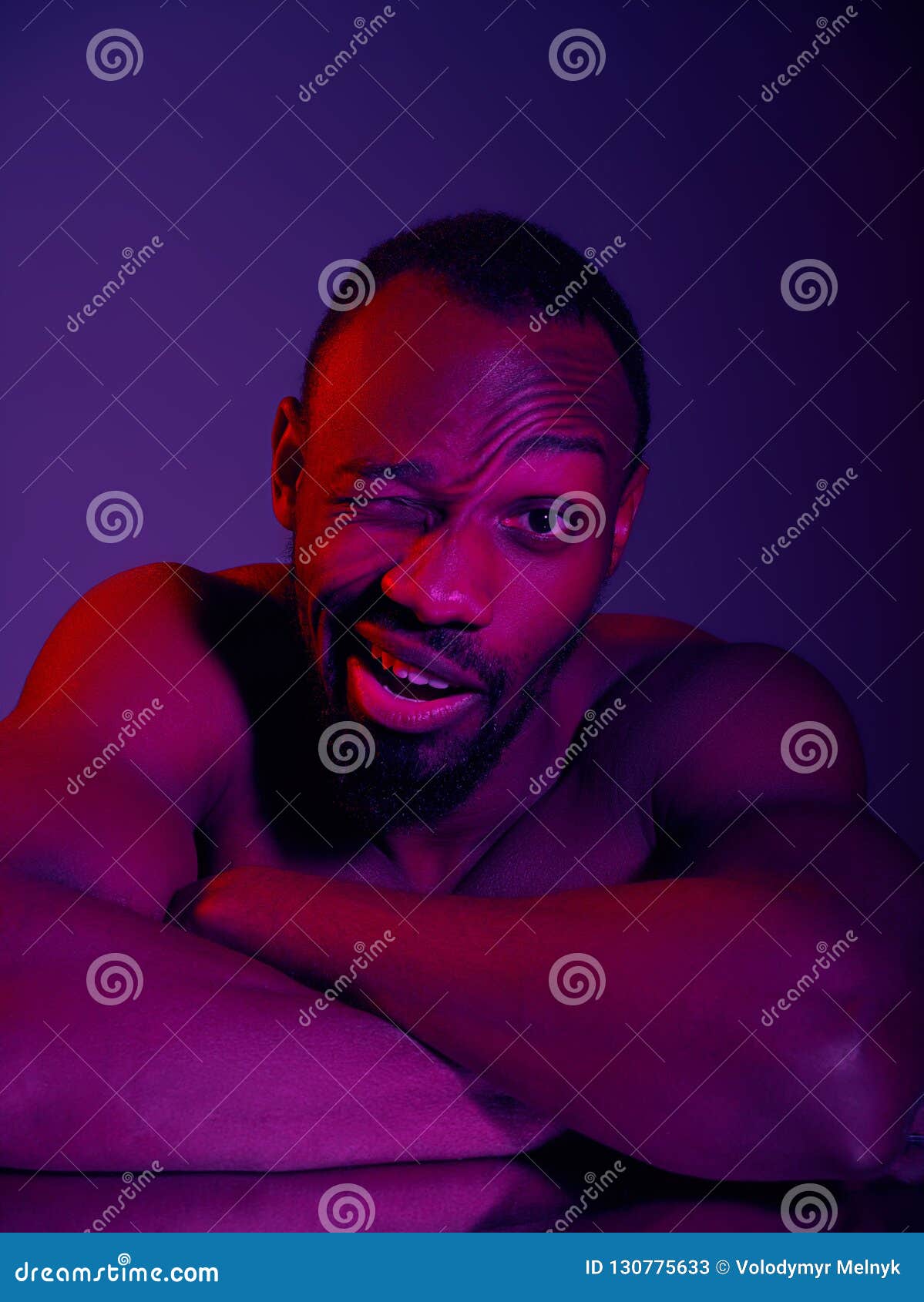 Portrait Of A Young Naked African Man At Studio High Fashion Male Model In Colorful Neon Bright 