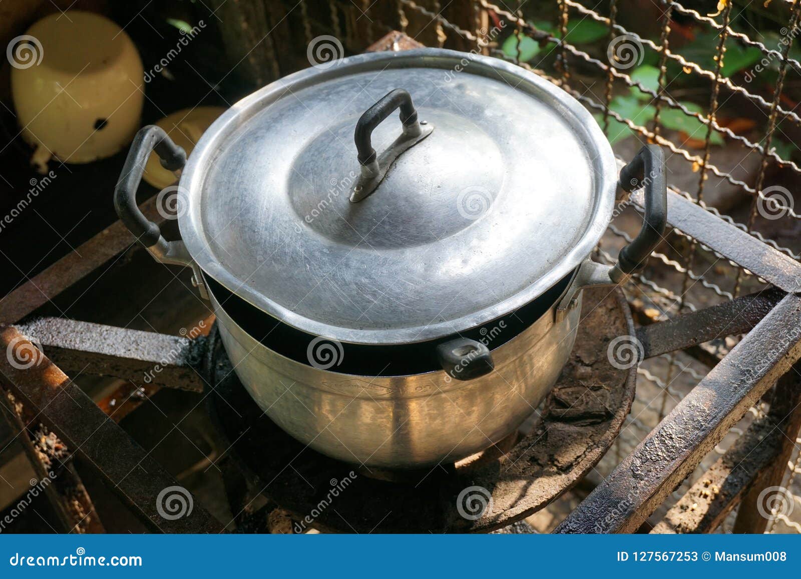 Pot boiled on fire stove stock image. Image of fire 127567253