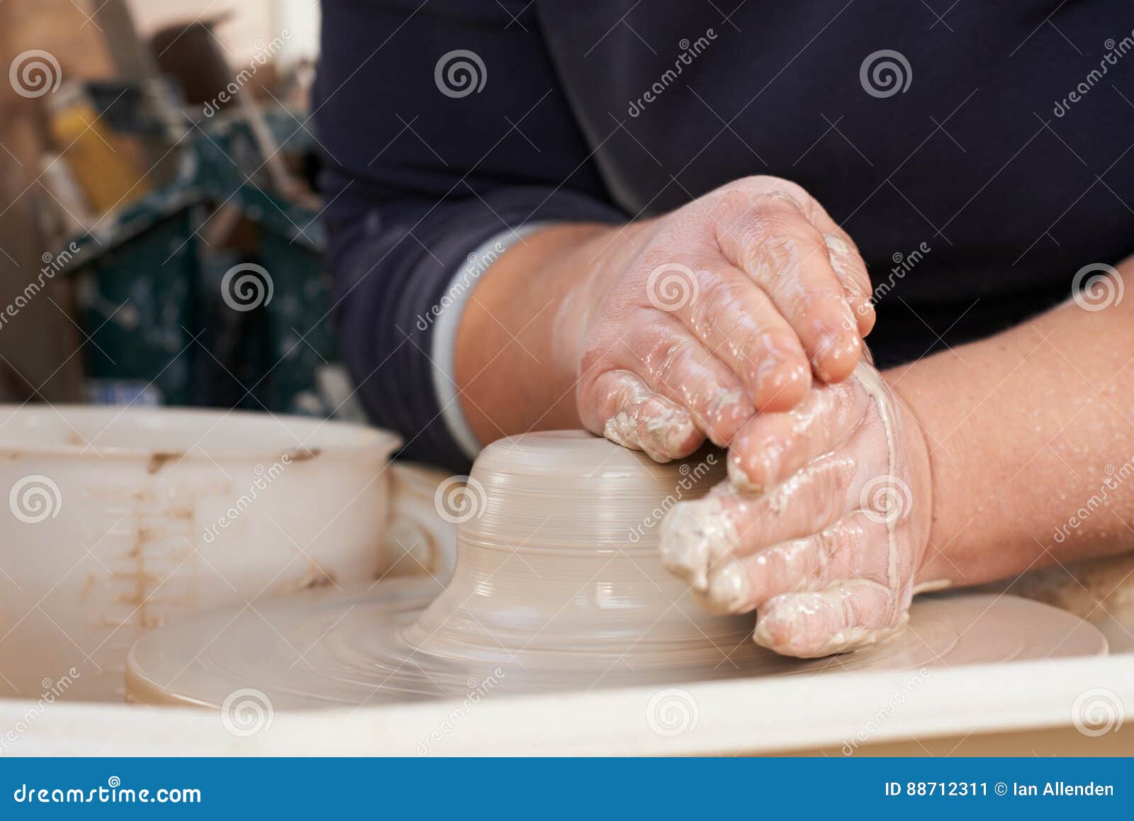 Close Up of Potter Moulding Clay on Wheel Stock Image Image of