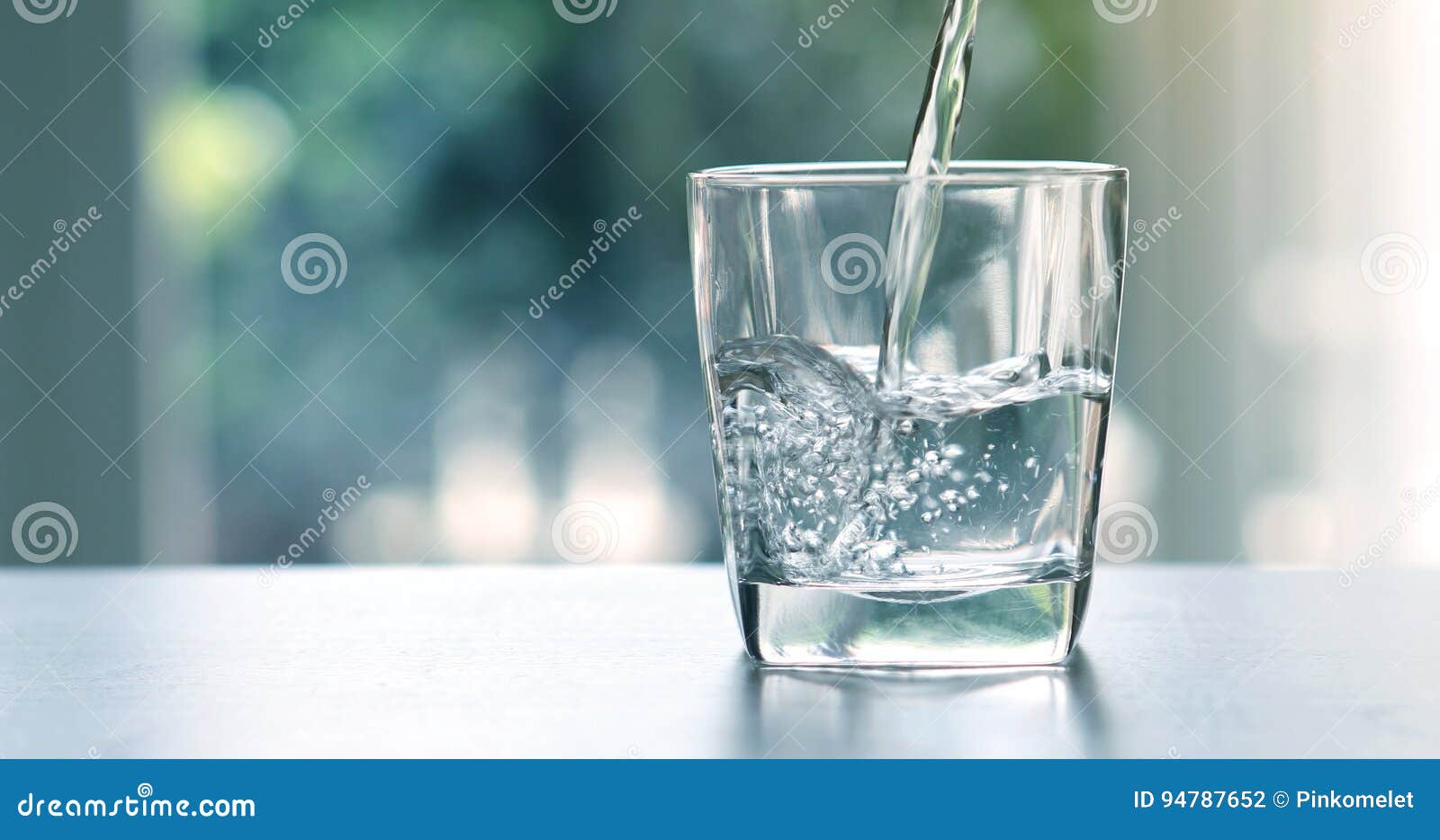 close up the pouring purified fresh drink water from the bottle