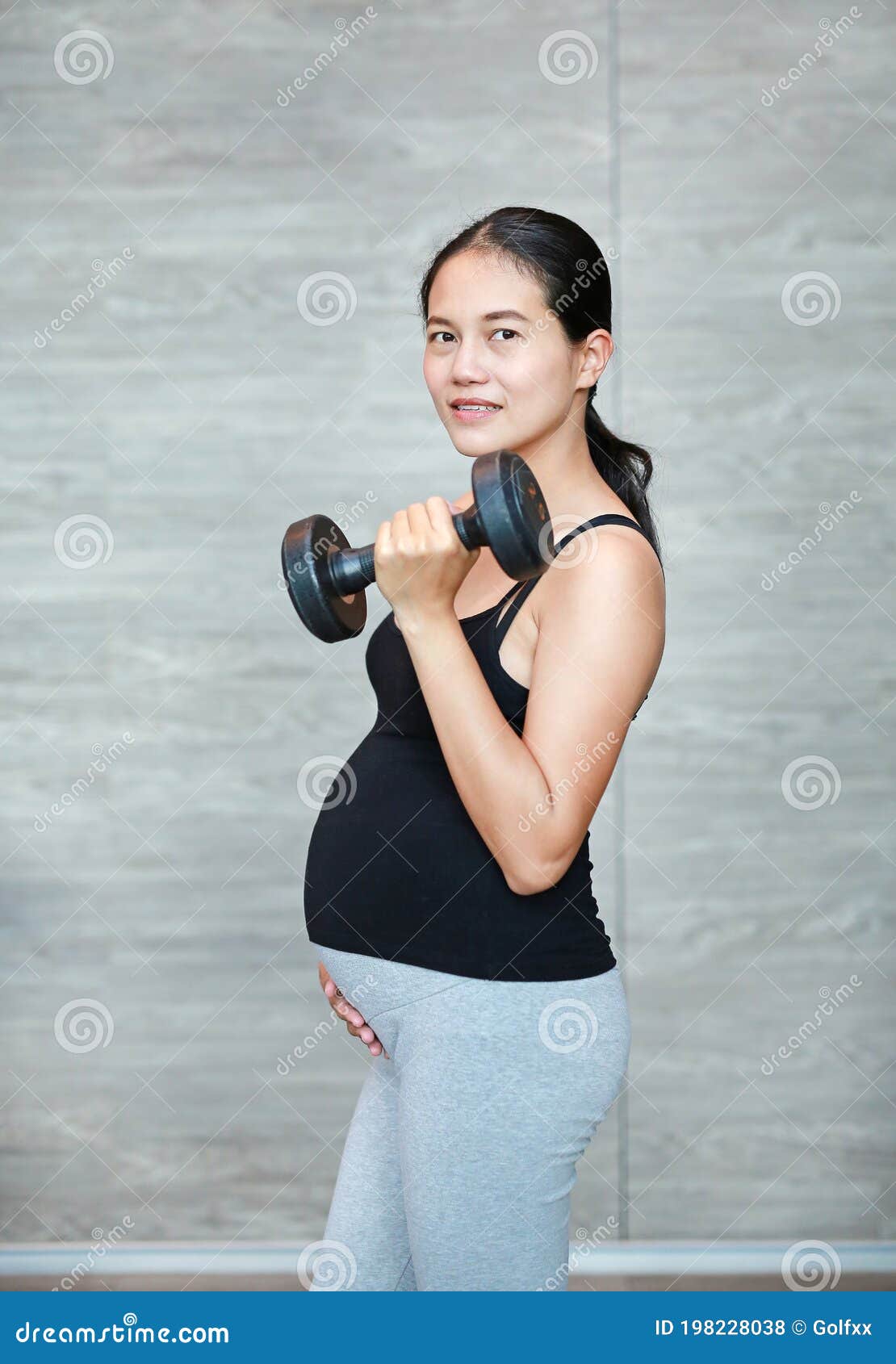 Close Up of Pregnant Woman Exercising with Weights Stock Photo - Image ...