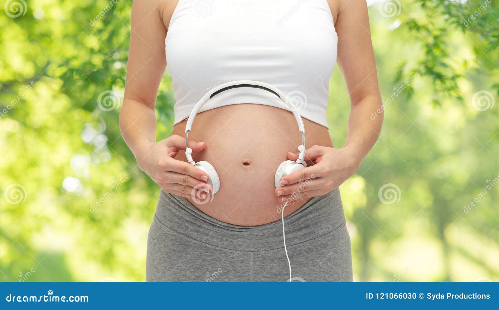 Melodies in the womb: Headphones placed on a pregnant belly, bonding  through music, a heartwarming connection between mother and baby Stock  Photo - Alamy