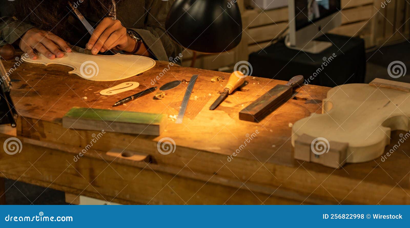 Closeup of a Professional Master Artisan Luthier Working on the