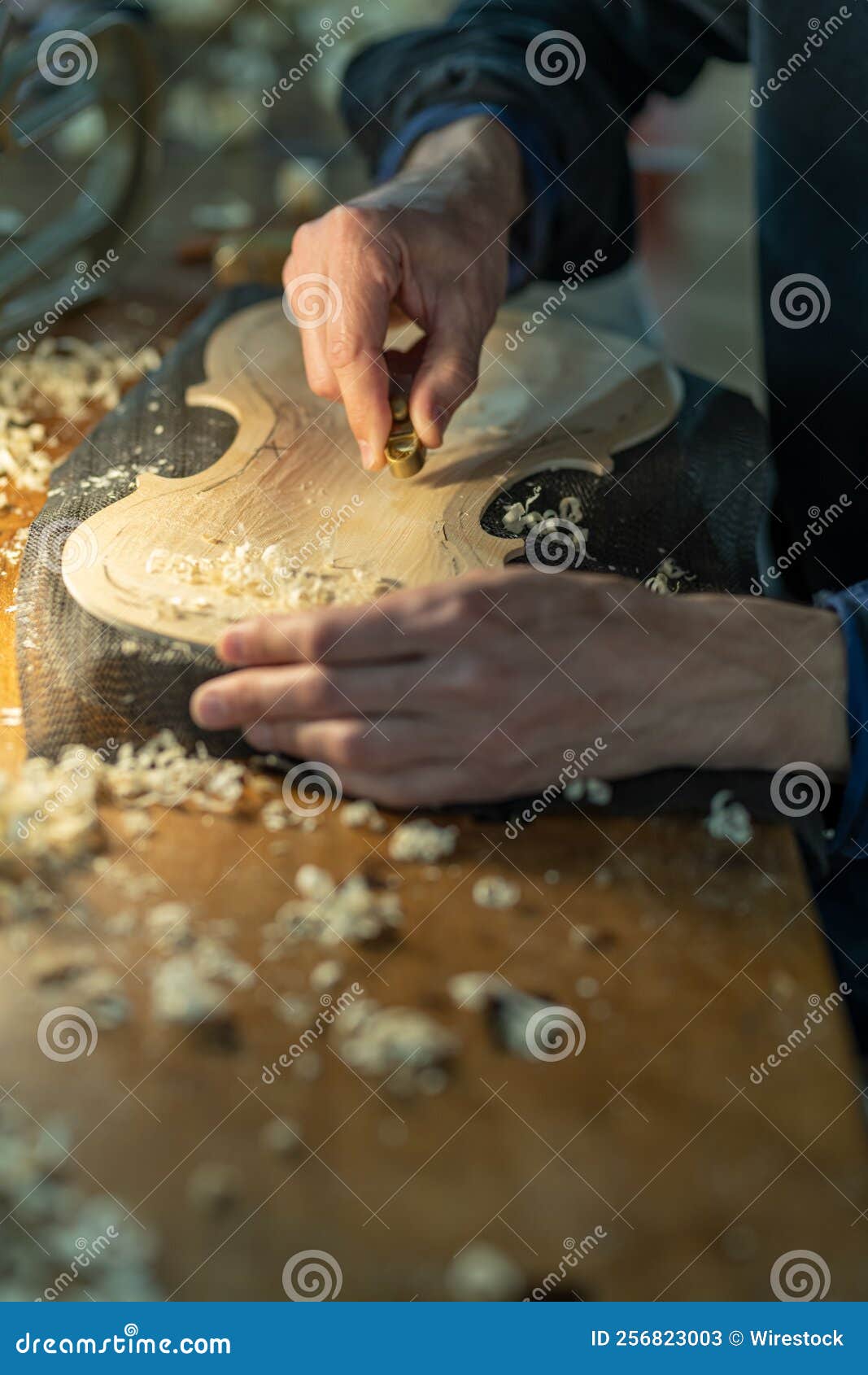 Closeup of a Professional Master Artisan Luthier Working on the
