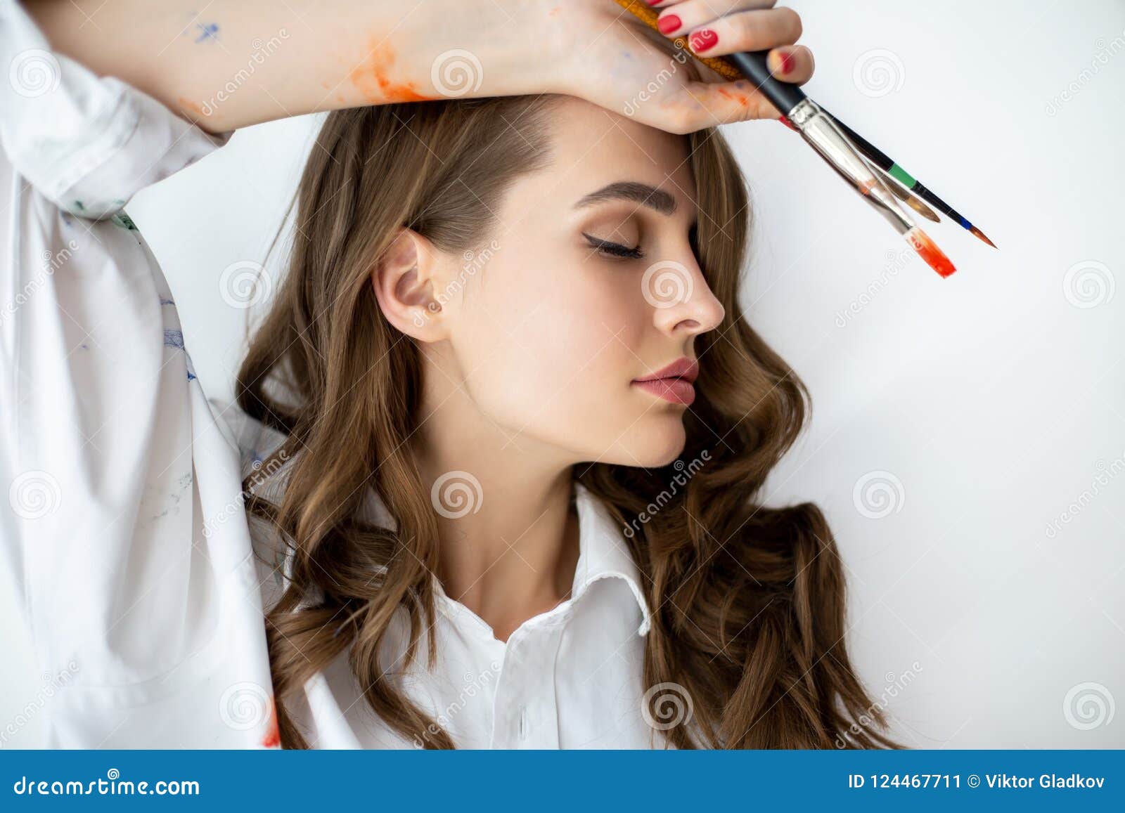 Close Up Profile Portrait of Sensual Beautiful Woman Painter Holding