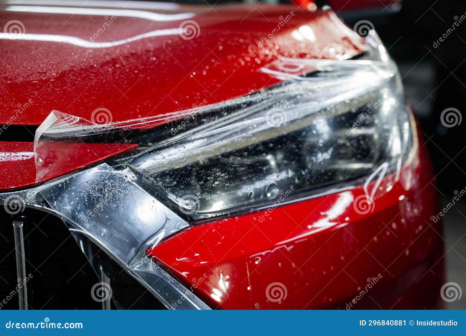 Closeup of a Red Car Headlight with Vinyl Wrap. Stock Image Image of