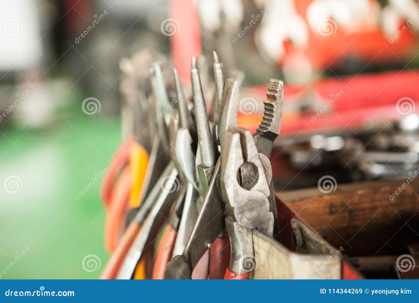 Close-up with red car toolbox and various repair tools