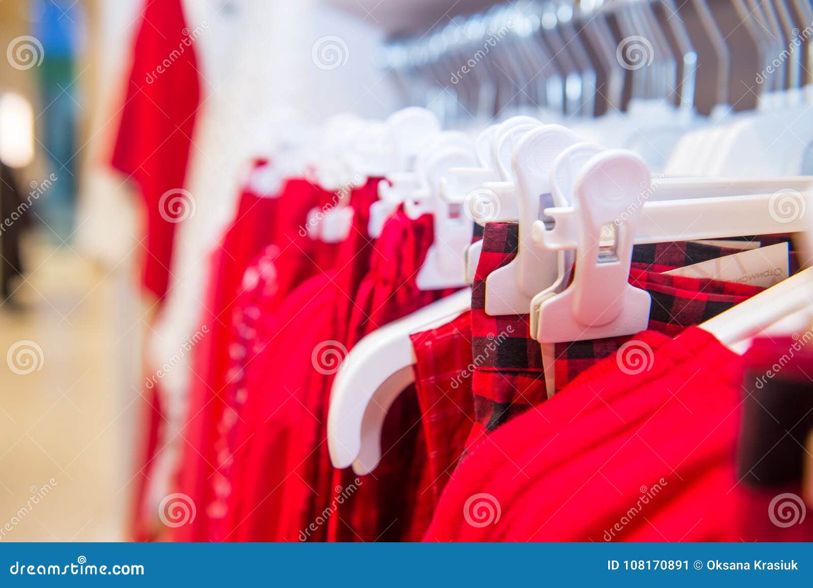 Close Up Red Color Clothes on Hangers in Shop, Butique. Make Outfit Set ...