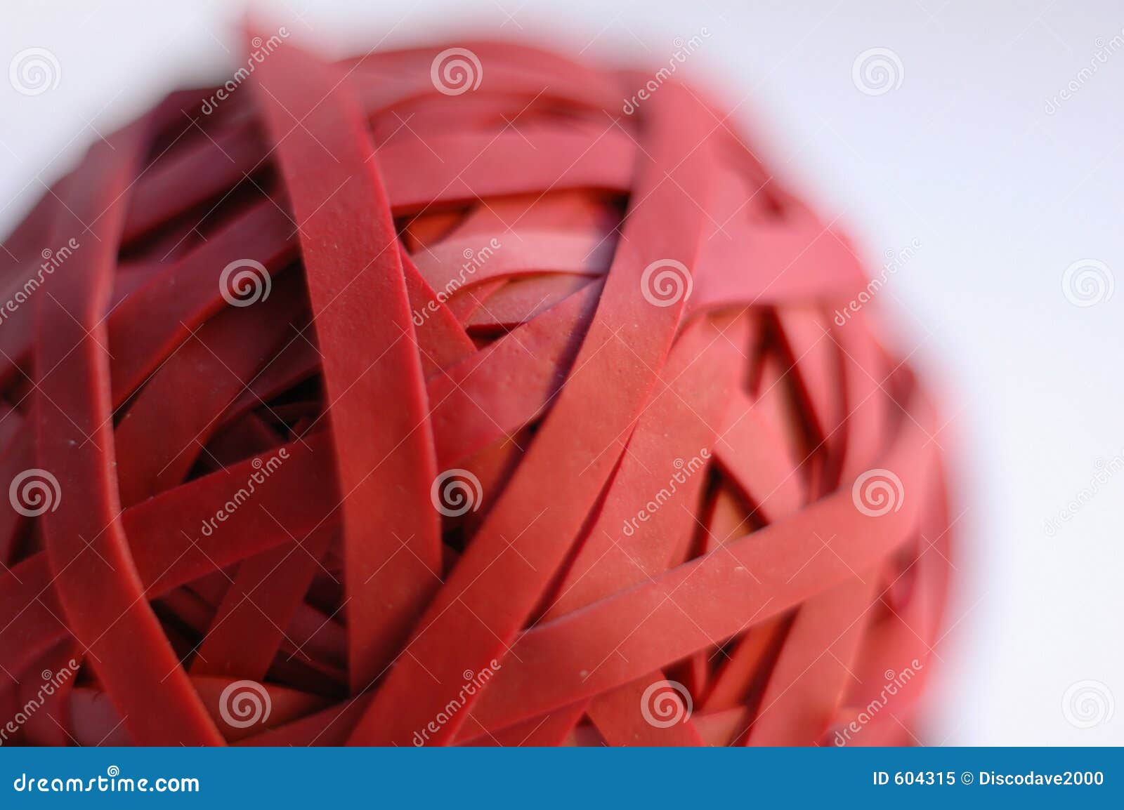 close up of a red rubber band ball