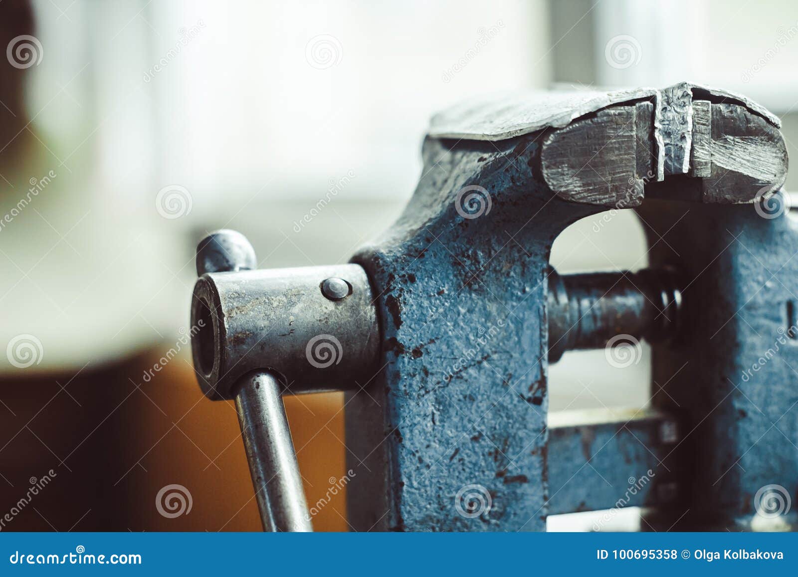 old iron vise on the table