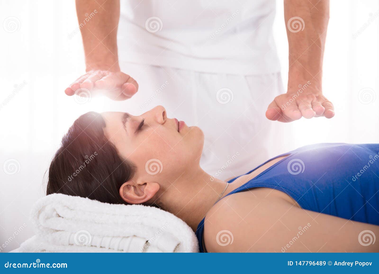 woman having reiki healing treatment