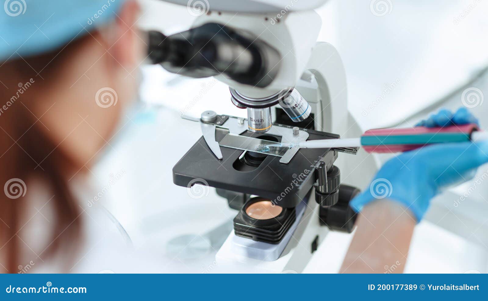 Close Up. Researcher Testing the Blood Under a Microscope Stock Image