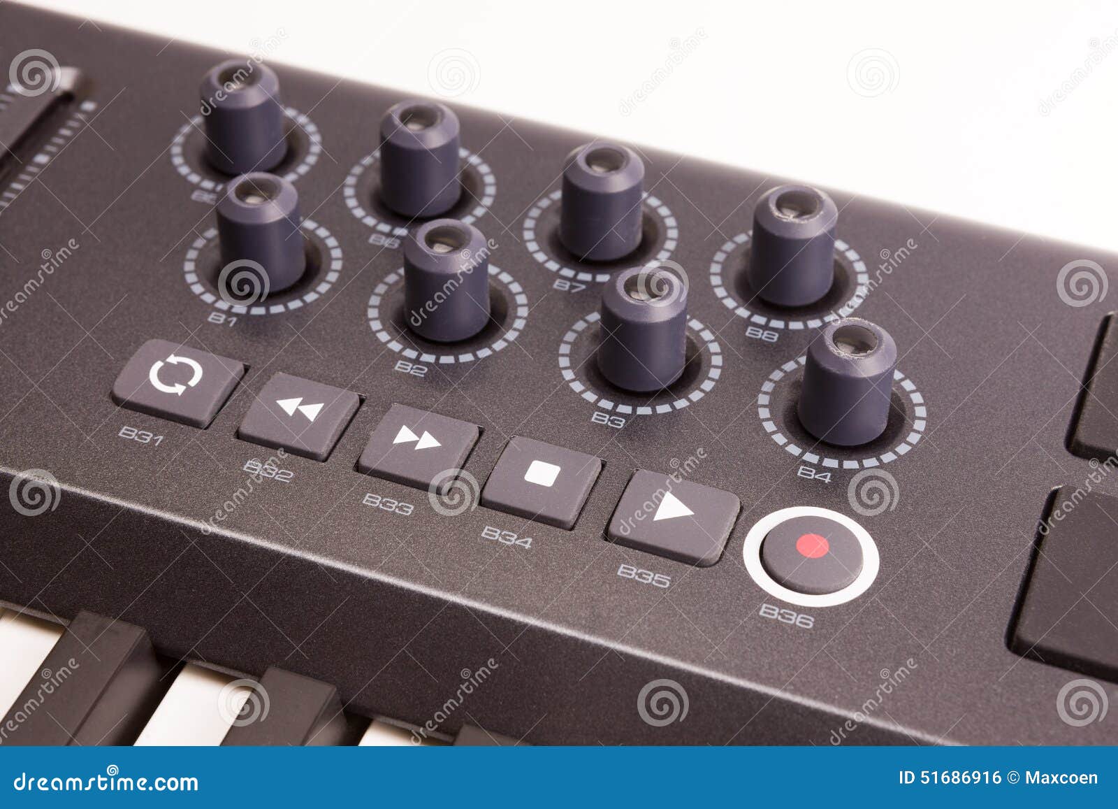 Close up of midi controller volume fader knob and keys royalty free
