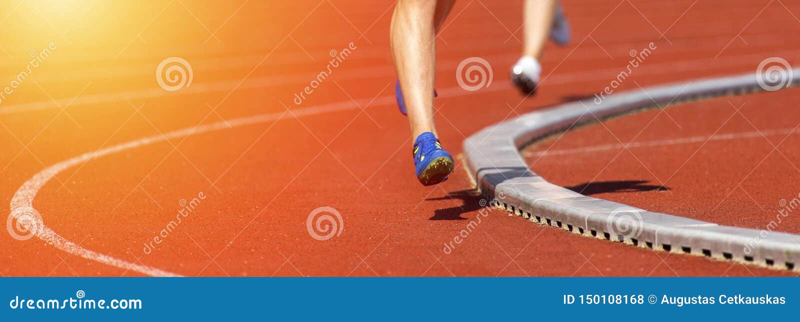 Close Up Of Runners Feet On The Track Field Sunny Day Stock Photo